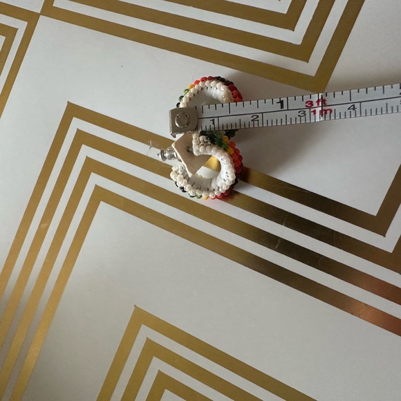 pair of white leather-wrapped rainbow beaded hoop earrings. - Picture 7 of 8